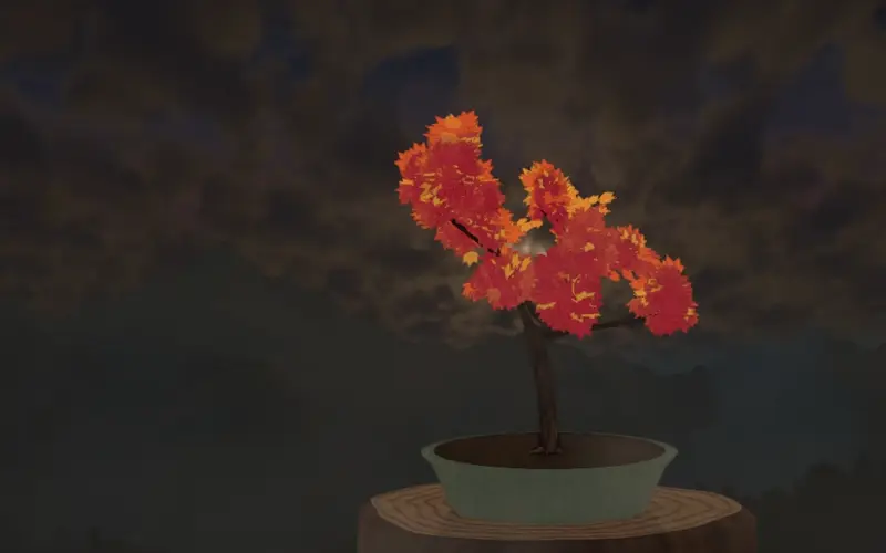 Le soir tombe derrière l'érable : les nuages passent de l'orangé au mauve.